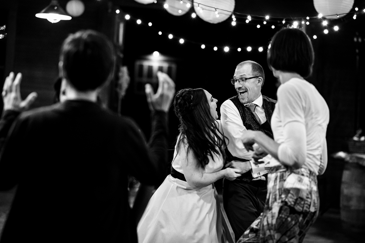 Couple dancing with great joy at rustic Vermont wedding.